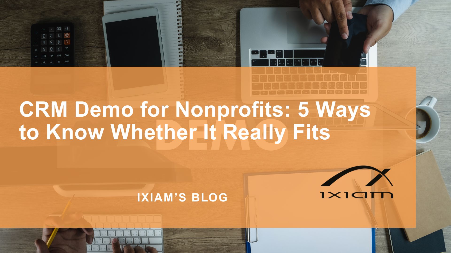 Hero image for a blog post titled 'CRM Demo for Nonprofits: 5 Ways to Know Whether It Really Fits,' with an orange translucent overlay over a workspace scene including a laptop, tablet, notebook, and coffee cup.